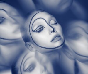 A surreal monochromatic blue photograph features the face of a person, their eyes closed, with a continuous black line drawing wrapping around from eyelid to surround the face.