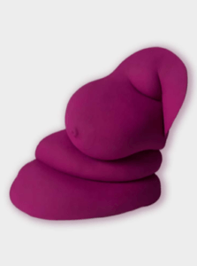 A deep magenta sculpture featuring a soft, abstract form with a smooth, rounded surface.